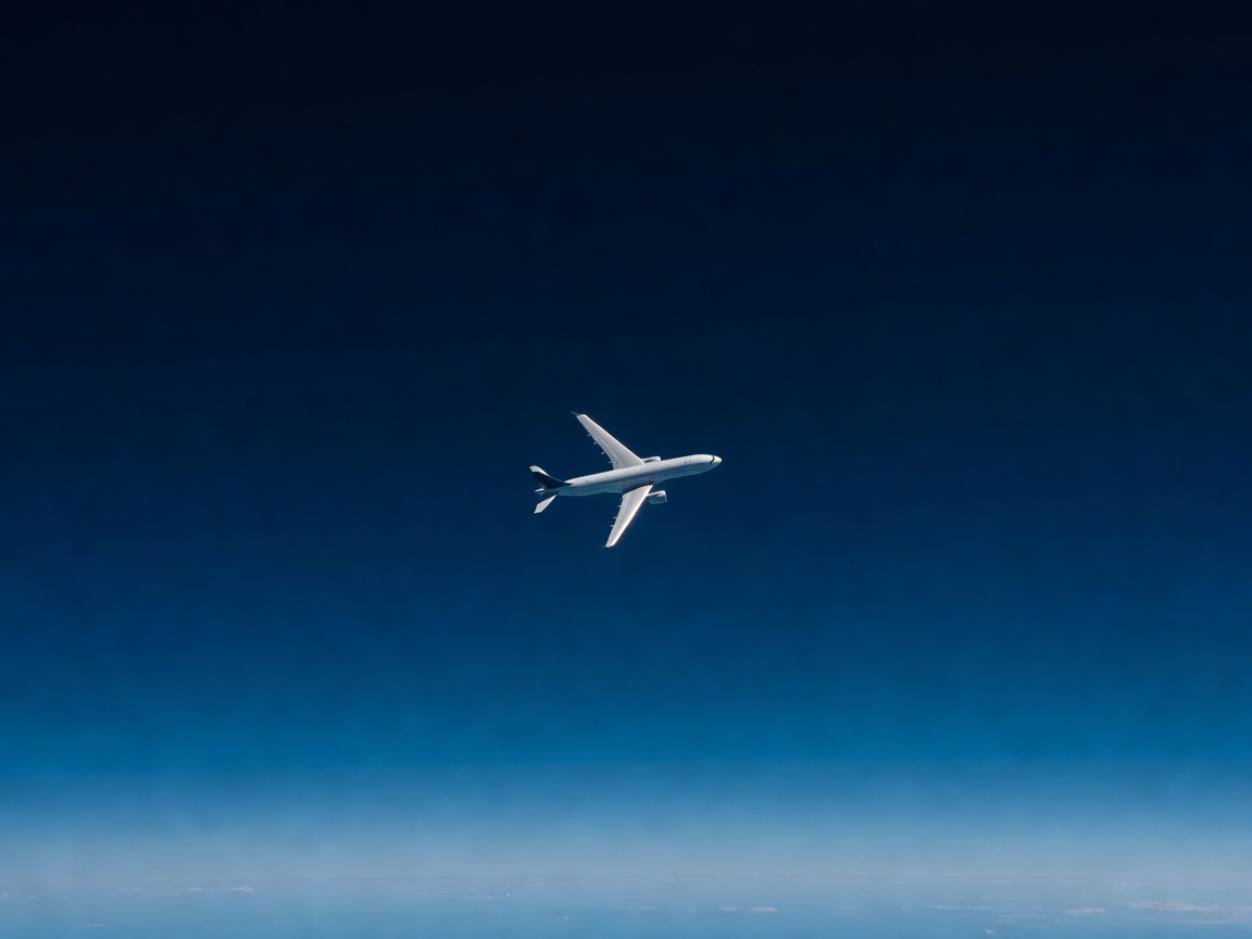 Ultra long range passenger jet cruising above clouds on record commercial route